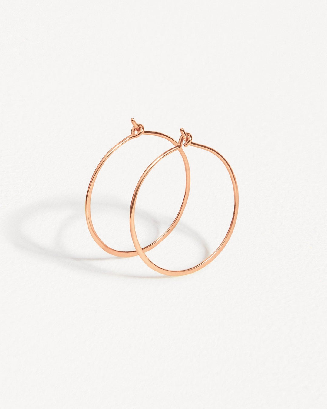 Rose gold-filled second-hole hoop earrings – dainty and minimalist style.