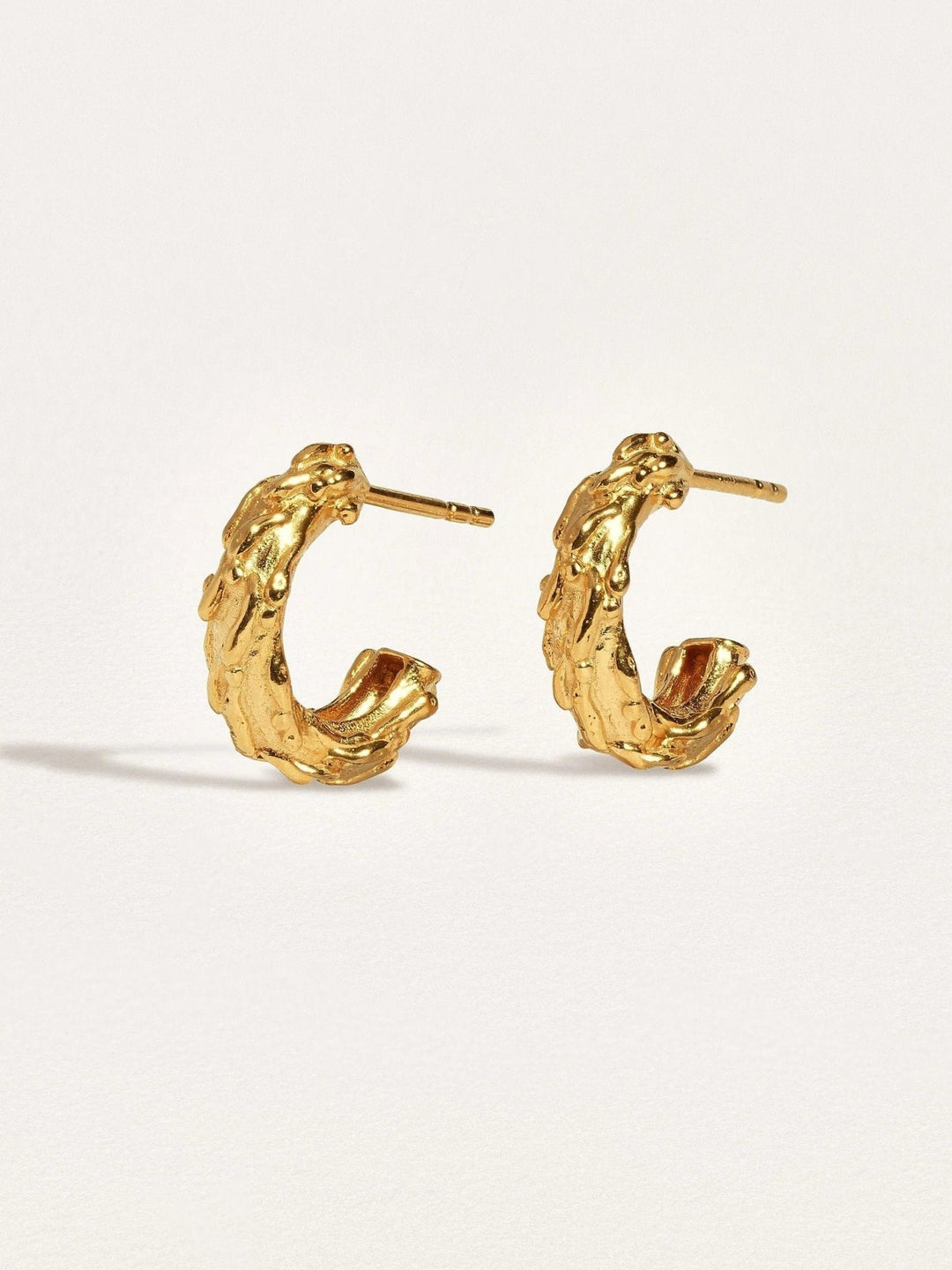 Groessa Raw Texture Open Hoop Earrings in 24K gold plating, close-up view.