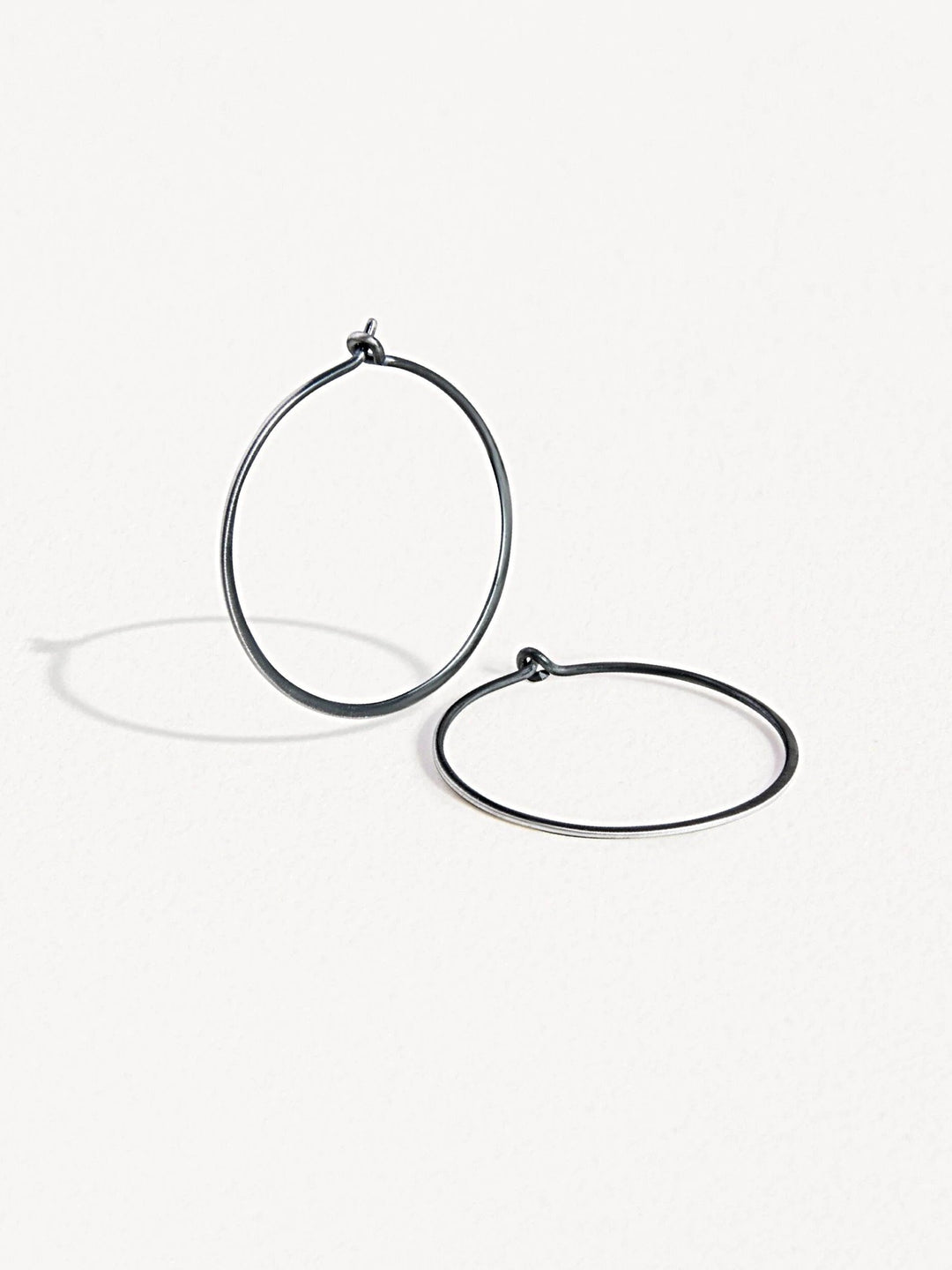 Oxidized sterling silver second-hole hoop earrings – minimalist and elegant design.